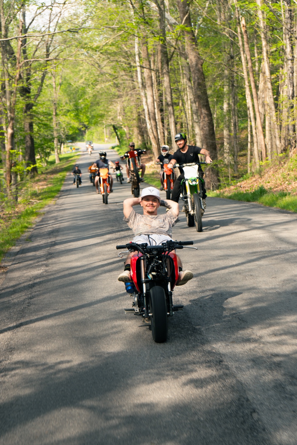 Group motorcycle ride through the woods