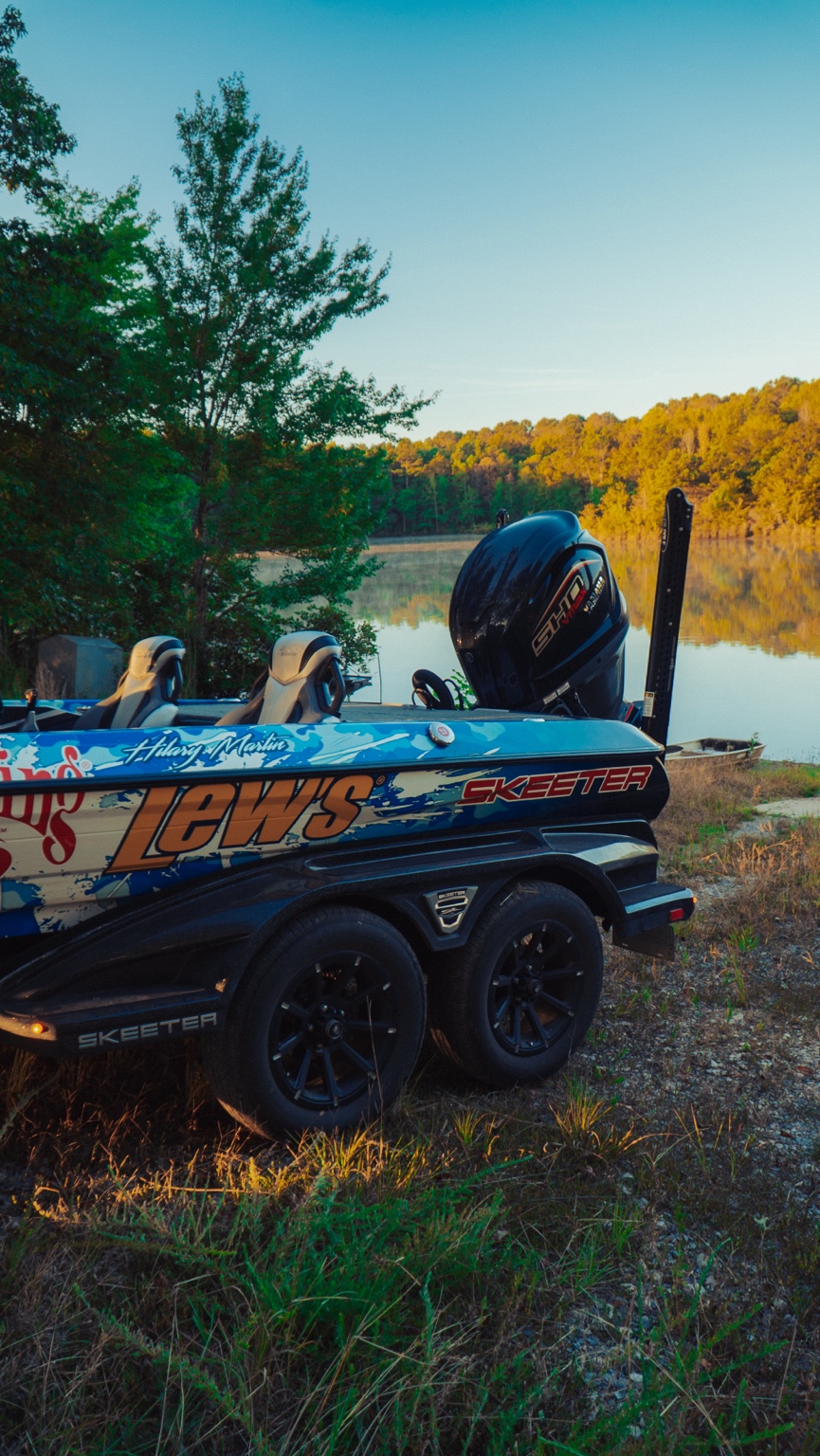 Bass boat and trailer in an autumn setting