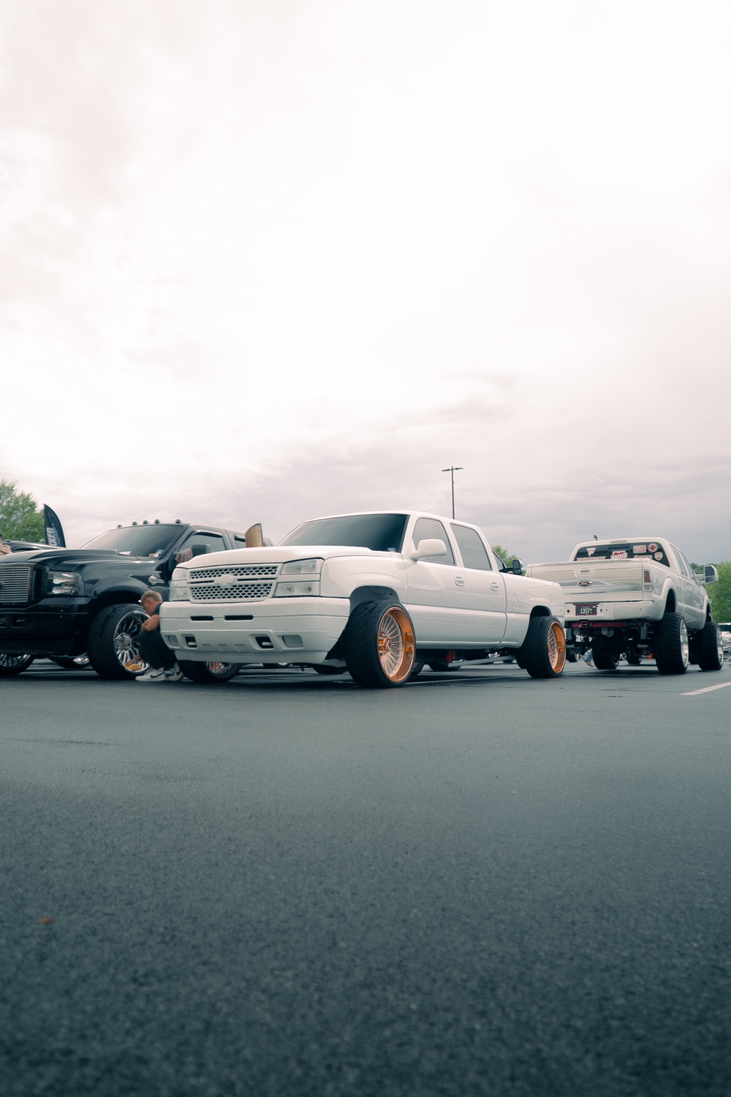 Custom trucks lined up at a show