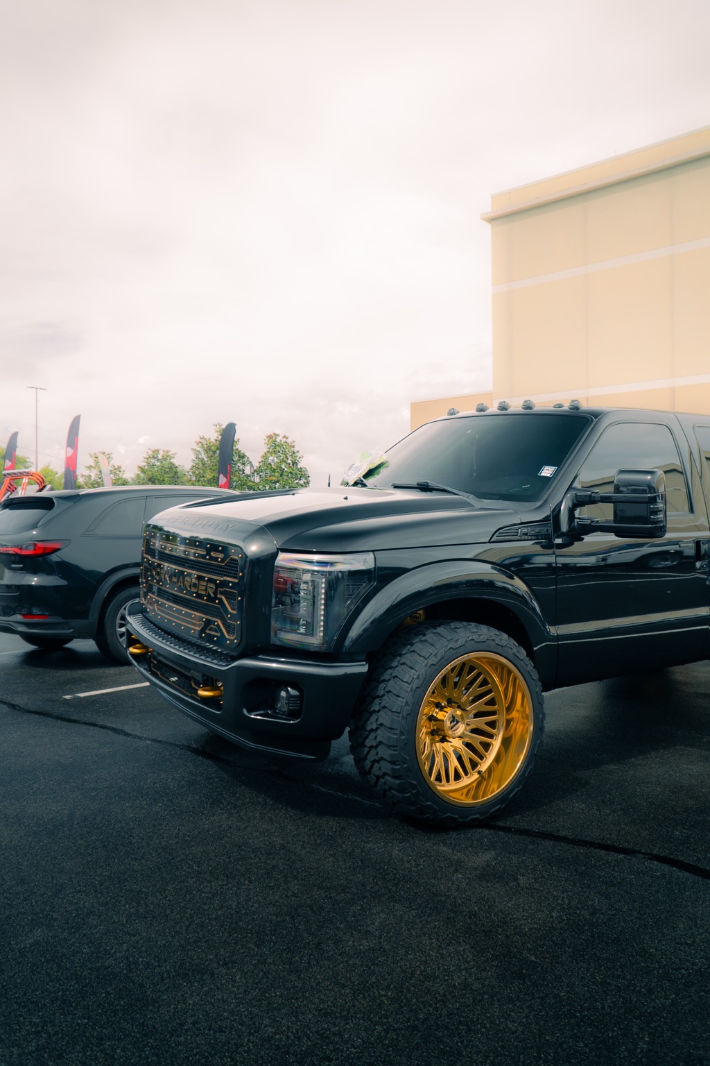 Black truck with gold wheels