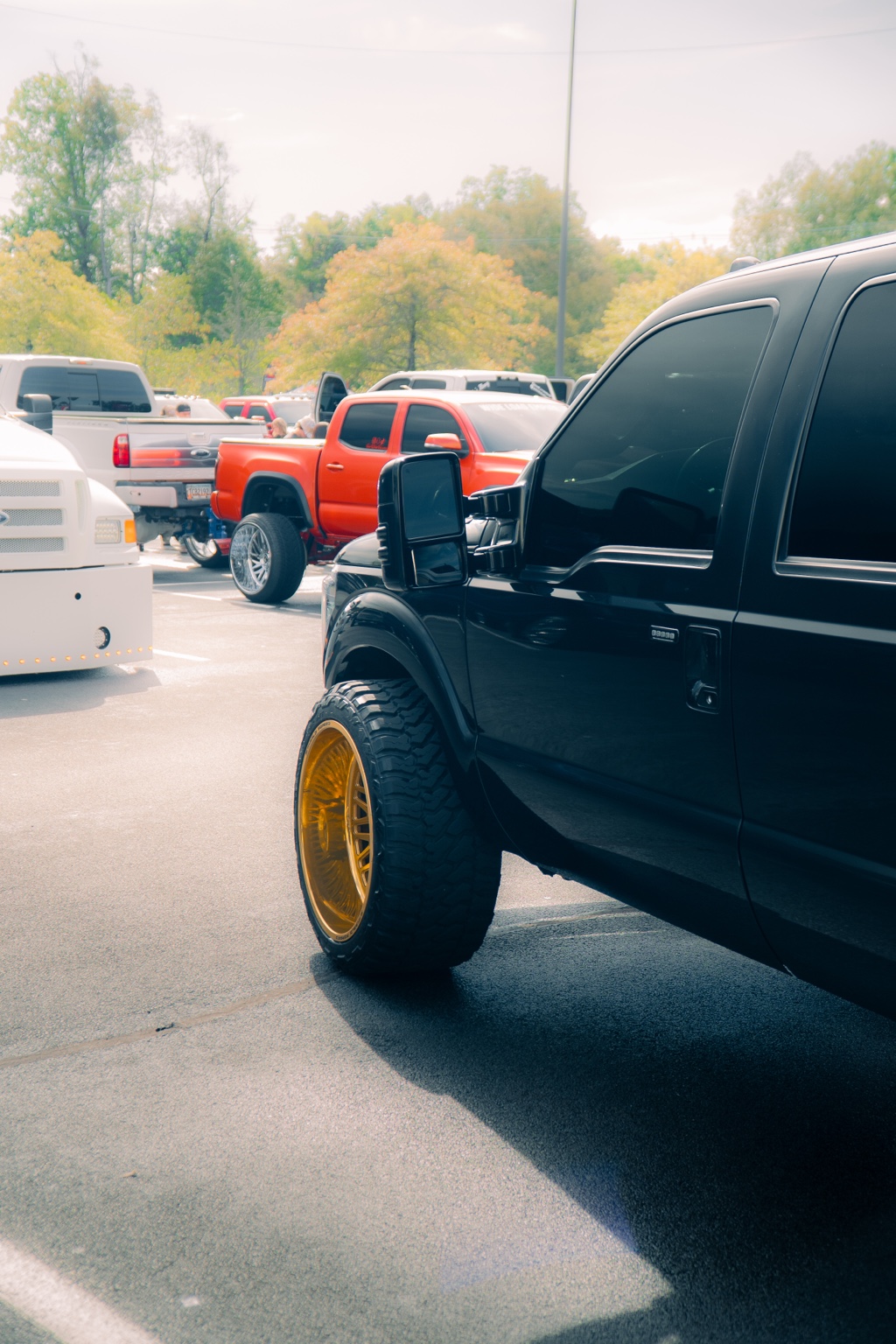 Gold wheel on a black custom truck