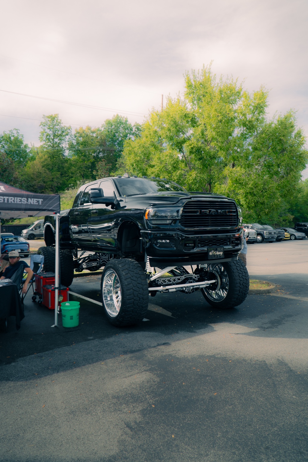 Black truck with custom gold wheels, photographed by Shot by JQ
